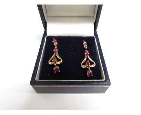 A pair of 9ct gold ruby and diamond drop earrings, 2.5cm drop, 2.1g 