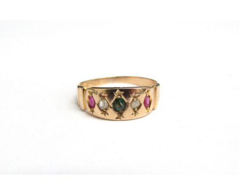 A 15ct gold ring with central emerald flanked by old cut diamonds and rubies in turn. Size K, 2.2g 