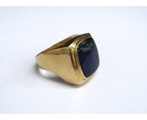 An unmarked gold signet ring set with a rounded square Lapis Lazuli. Size X/Y, 13.6g 