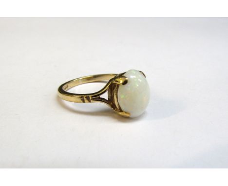 A 9ct gold ring with oval cabochon opal. Size L/M, 2.5g 