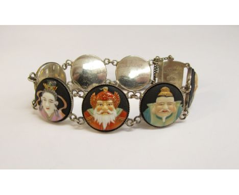 A Toshikane Japan silver seven panel bracelet, each circular panel depicting a sage, 18cm long 