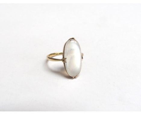 A gold ring with an oval cabochon moonstone, unmarked. Size K, 2g 