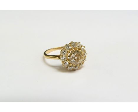 A diamond cluster ring, the central coloured diamond framed by twelve old cut white diamonds, 1.50ct total approx, marks rubb