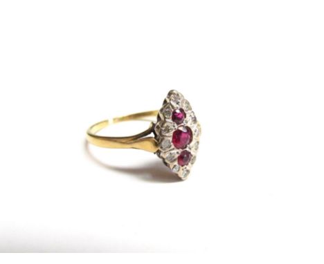 An 18ct gold ruby and diamond navette ring. Size N, 2.7g 