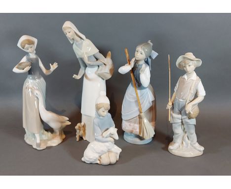 A Lladro porcelain model in the form of a fisherman together with four Lladro porcelain figures 