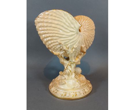 A Royal Worcester blush ivory vase in the form of a conch shell with pedestal base, 21cms tall 