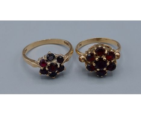 A 9ct gold garnet set cluster ring together with another similar 9ct gold garnet set cluster ring, 5.8gms, ring size K and O 