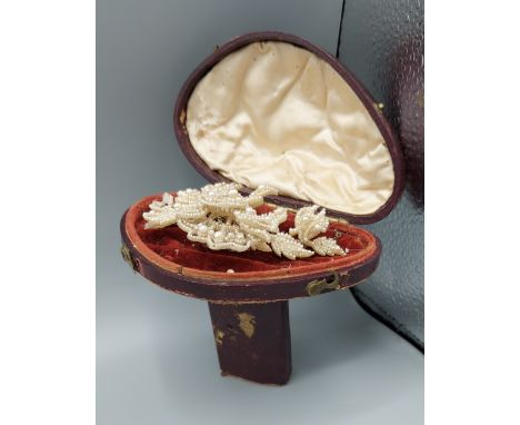 A 19th Century seed pearl wedding brooch within fitted box 