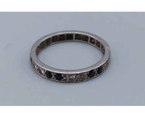 A white gold diamond and sapphire full eternity ring, 3gms, ring size N 