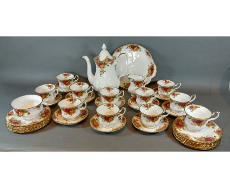 A Royal Albert Old Country Roses tea service, comprising ten cups and saucers, hot water pot, cream jug, sugar bowl and side 