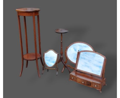 An Edwardian mahogany jardinier stand together with a mahogany wine table, three swing frame toilet mirrors and a 19th Centur