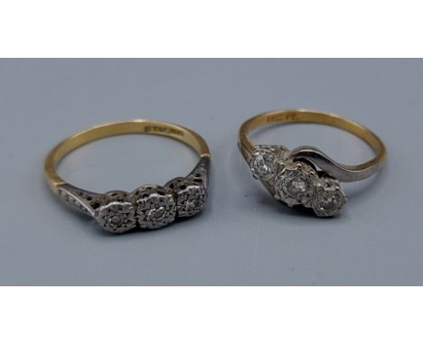 An 18ct gold three stone diamond ring, illusion set together with another similar 18ct gold three stone diamond ring, 6gms, r