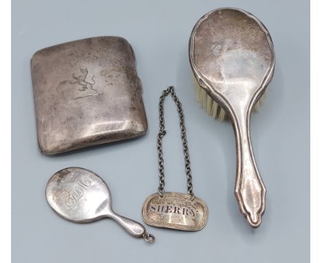 A Birmingham silver cigarette case together with a silver backed brush, a silver miniature hand mirror and a silver decanter 