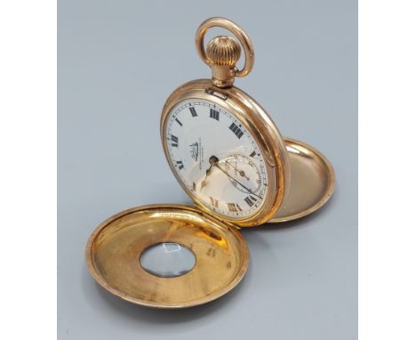 Spikens from Dent London, a gold plated half hunter pocket watch, the enamel dial with Roman numerals and subsidiary seconds 