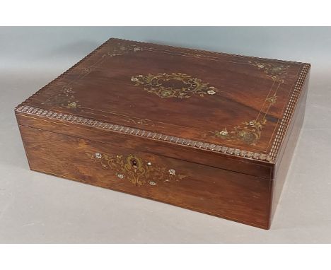 A 19th Century French rosewood, brass and Mother Of Pearl inlaid dressing box with lock, the hinged cover enclosing a velvet 