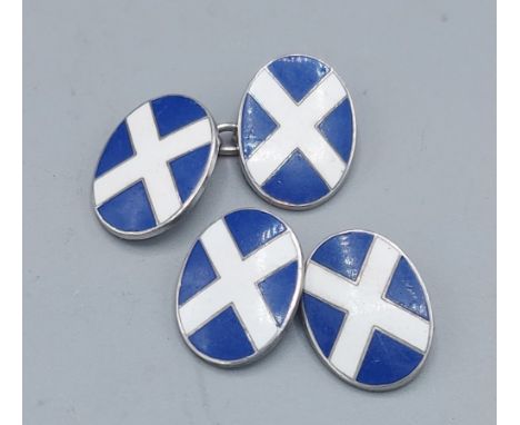 A pair of sterling silver and enamel decorated cuff links in the form of the Scottish flag 