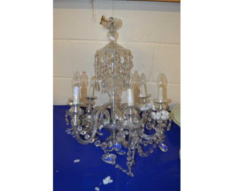 A 20th Century clear glass six branch chandelier with hanging glass drapes
