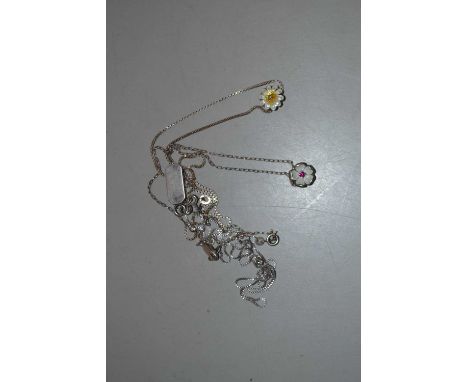 Two floral gemset and enamel pendant necklaces, one daisy pendant in white and yellow enamel set with a small round diamond, 
