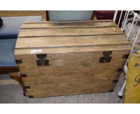 A pine dome topped trunk with metal carry handles