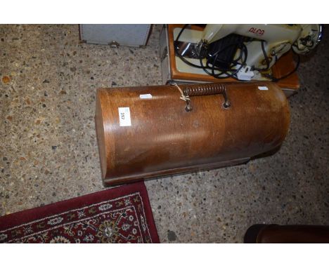 A vintage Singer sewing machine in wooden case