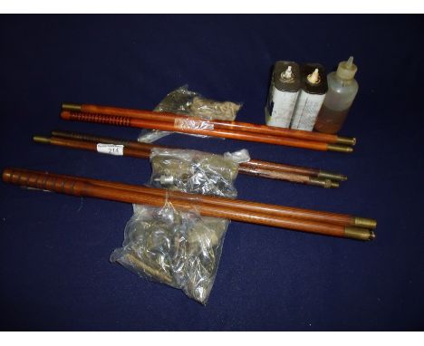 Three two sectional vintage wooden cleaning rods and three oil bottles with various brushes 
