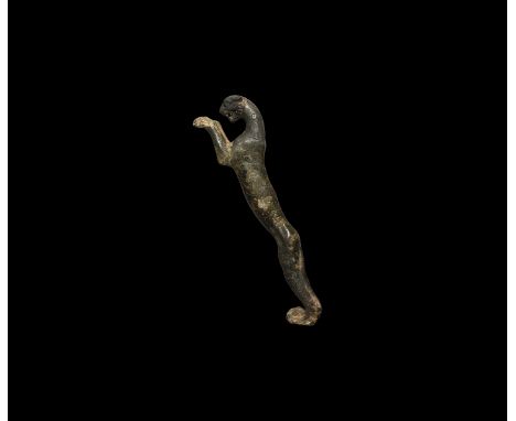 1st-2nd century AD. A large bronze mount or handle of a leaping panther with applied pointillé texture and ring-and-dot patte