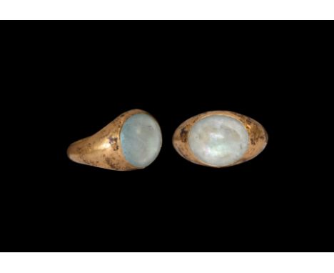 2nd century AD. A hollow-formed gold ring comprising a D-section hoop, broad bezel with inset glass cabochon. Cf. Ruseva-Slok
