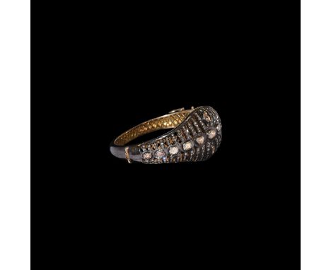18th century AD. A hollow-formed silver bracelet comprising D-section hoop and flared shoulders, openwork expanding plaque wi