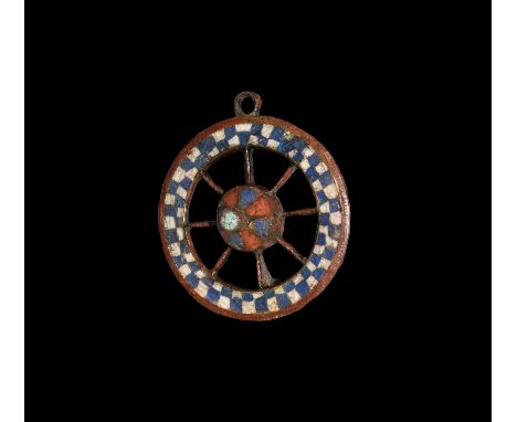 2nd century AD. A large discoid plate brooch with hub and spokes to the outer ring, enamelled spur centre to the hub and radi