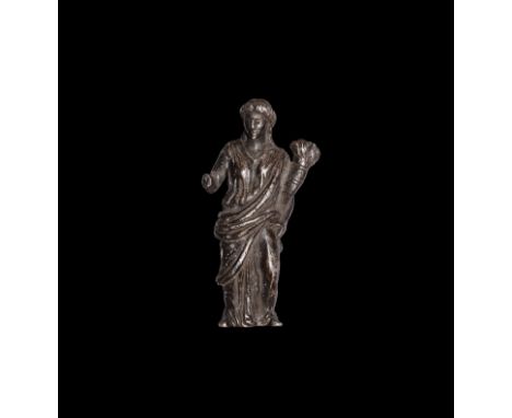 1st century BC-1st century AD. A silver figure of goddess Fortuna (Greek Tyche) standing wearing a peplos and draped palla, t