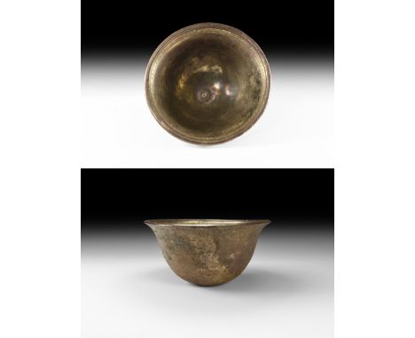 4th-1st century BC. A large heavy silver cup with gilt frieze to the inside of the rim with repeating wave pattern; slightly 