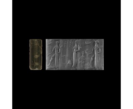 19th-late 16th century BC. A jasper cylinder seal with a robed king holding in both hands a kid as an animal offering, facing