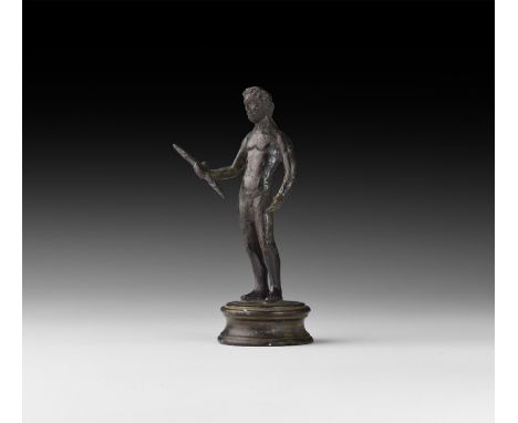 1st century BC-1st century AD. A bronze statuette of Jupiter standing nude with left hand cupped to hold a patera(?) and righ