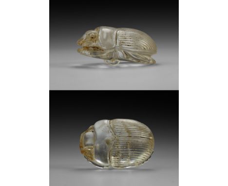 Saite Period, 624-525 BC. A substantial carved rock crystal scarab, detailed underside with ribbed suspension loop. Cf. Andre