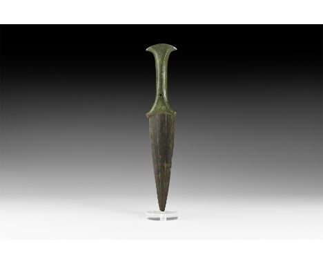 Early 1st millennium BC. A bronze dagger of Type Loucé comprising a lentoid-section triangular blade with incised convergent 