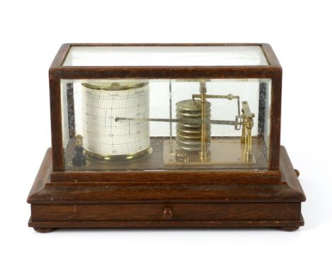 A barograph by Dollond in an oak case with bevelled glass panels and incorporating an ink bottle and a drawer with spare grap