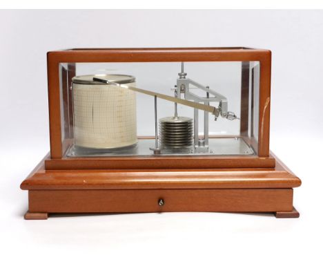 A modern 1980s barograph by Casella in a teak case with bevelled glass panels and incorporating a drawer with spare graph pap