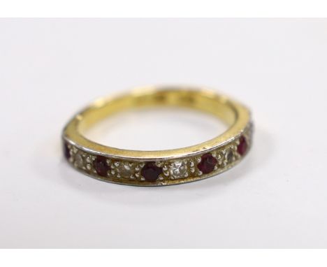 A 18ct and plat. six stone ruby and five stone diamond chip set half hoop ring, size L/M, gross weight 3.6 grams.