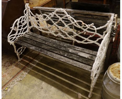 A Victorian Coalbrookdale design painted cast iron garden bench, length 138cm, depth 55cm, height 86cm