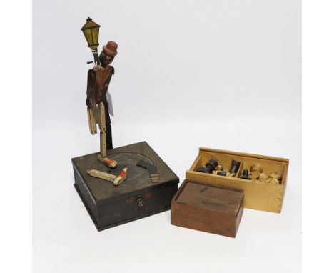 Two turned wood chess sets and a dancing toy