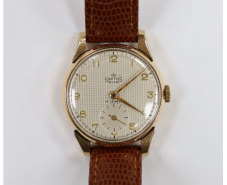 A gentleman's 9ct gold Smiths Deluxe manual wind wrist watch, on later leather strap, case diameter 32mm.