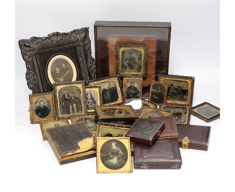 A collection of mid 19th century ambrotype portrait photographs, all mounted in brass etc frames, some in decorative cases, t