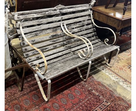 A vintage wrought iron and weathered teak two-seater garden bench, length 121cm, height 82cm