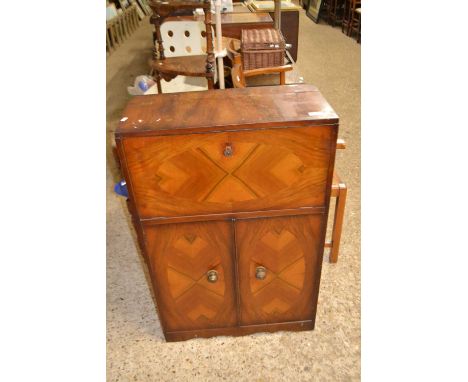 A small Art Deco style drinks cabinet with drop down front