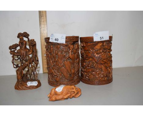 Two contemporary Chinese brush pots together with a further figure and a further carved abstract ornament (4)