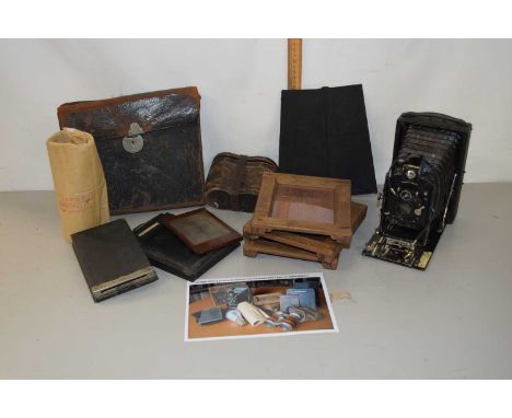 A box of mixed items to include a folding postcard camera, opera glasses etc