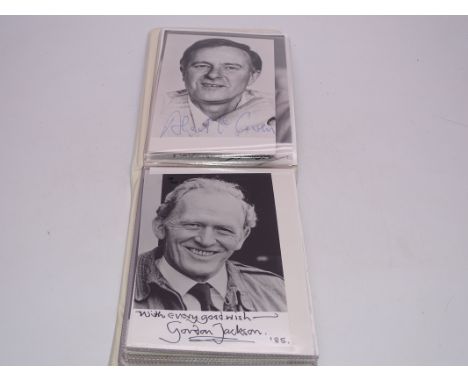 AUTOGRAPHS: A small photograph album containing signed photographs (mostly hand signed, some printed) to include: BERNARD BRE