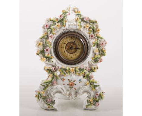 Continental porcelain mantel clock, encrusted and painted decoration with roses,No.1037, 23cms.