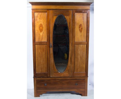 Edwardian mahogany wardrobe, cavetto moulded cornice, plain frieze, oval mirror-panelled door, flanked by marquetry inlaid pa