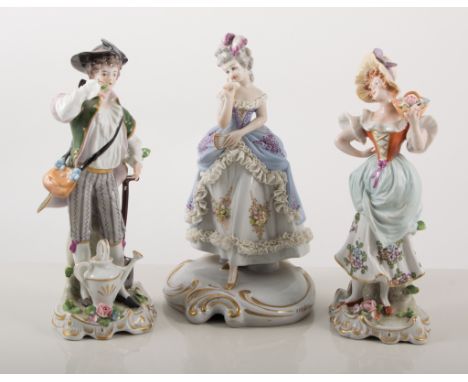 Pair of Sitzendorf porcelain figures, lady and gentleman gardeners, in 18th century dress, painted in colours, 20cm; and a pa